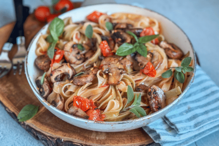 A quick and delicious spinach pasta with sautéed mushrooms, cherry tomatoes, garlic, and herbs. Perfect for weeknights or cozy date nights!