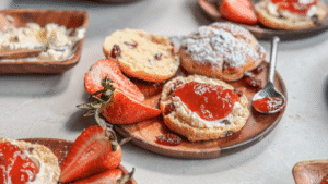 These tender, lightly sweet scones are filled with tart dried cranberries and topped with a golden, glossy finish. Perfect for brunch, tea, or whenever you need a cozy bite.