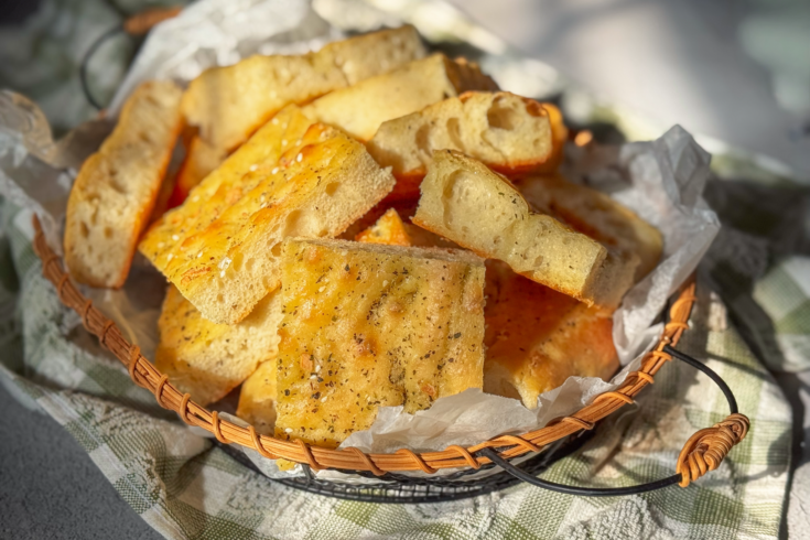 This Olive Oil Flatbread with Herbs is fluffy and airy inside with golden edges, garlic, herbs, flaky salt, and plenty of good olive oil.