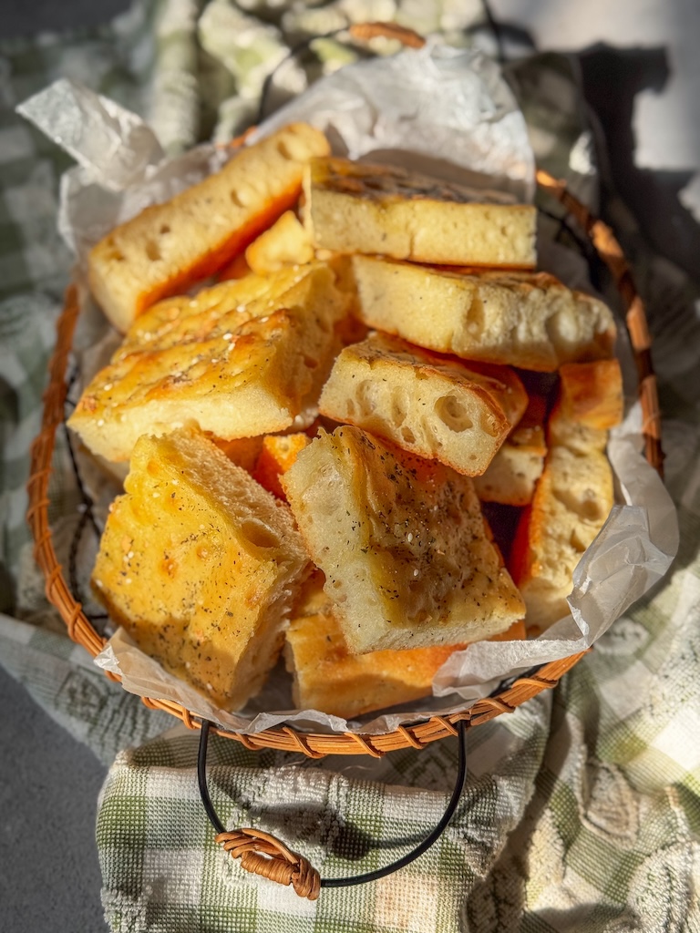 Olive Oil Flatbread with Herbs cut into thick, fluffy squares