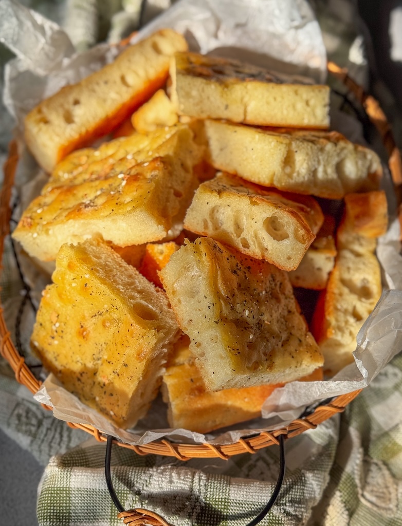 Olive Oil Flatbread with Herbs cut into thick, fluffy squares