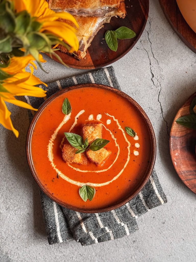 Cozy up with this Creamy Roasted Tomato Soup made from oven-roasted tomatoes, garlic, and herbs. Smooth, rich, and full of flavor — perfect for chilly days!