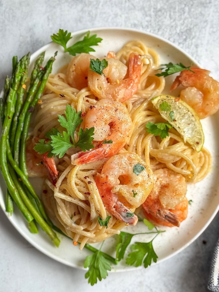 Creamy gluten-free shrimp Alfredo pasta in a bowl