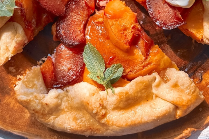 This easy Plum and Peach Galette is the perfect summer dessert! Made with sweet peaches, juicy plums, and a buttery homemade crust, this rustic fruit galette is simple to make and absolutely delicious served warm with vanilla ice cream.