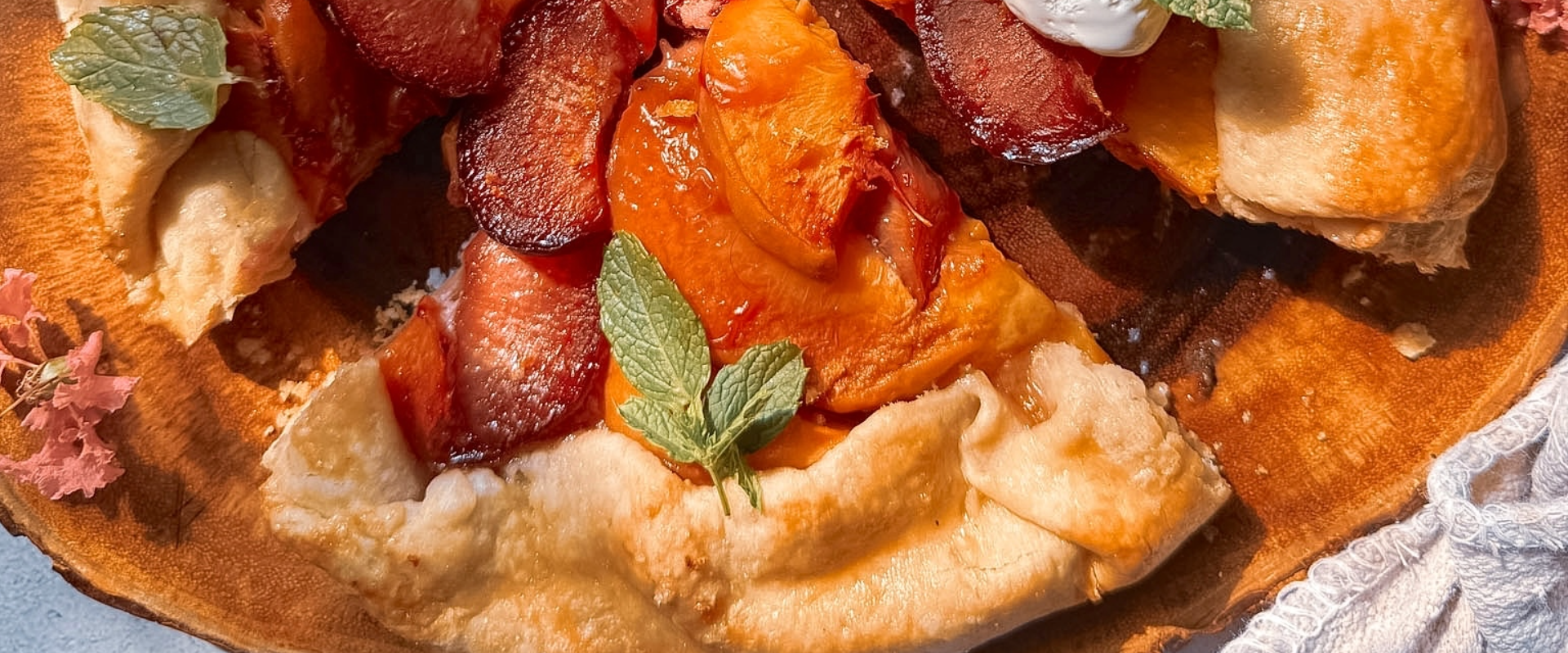 This easy Plum and Peach Galette is the perfect summer dessert! Made with sweet peaches, juicy plums, and a buttery homemade crust, this rustic fruit galette is simple to make and absolutely delicious served warm with vanilla ice cream.