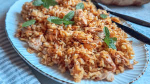 Fragrant chicken biryani made with spiced yogurt-marinated chicken, basmati rice, and caramelized onions. A comforting one-pot meal full of warmth and flavor.