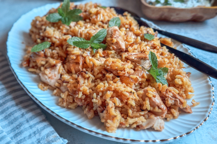 Indian recipe with rice, chicken, and herbs
