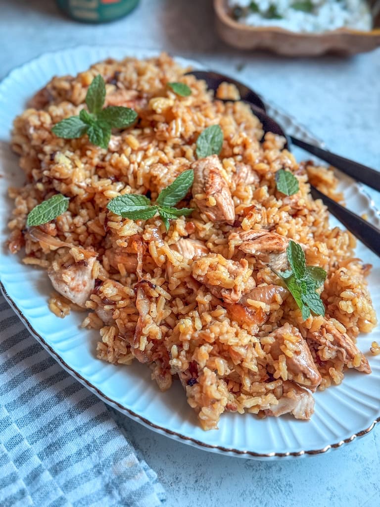 Fragrant chicken biryani made with spiced yogurt-marinated chicken, basmati rice, and caramelized onions. A comforting one-pot meal full of warmth and flavor.
