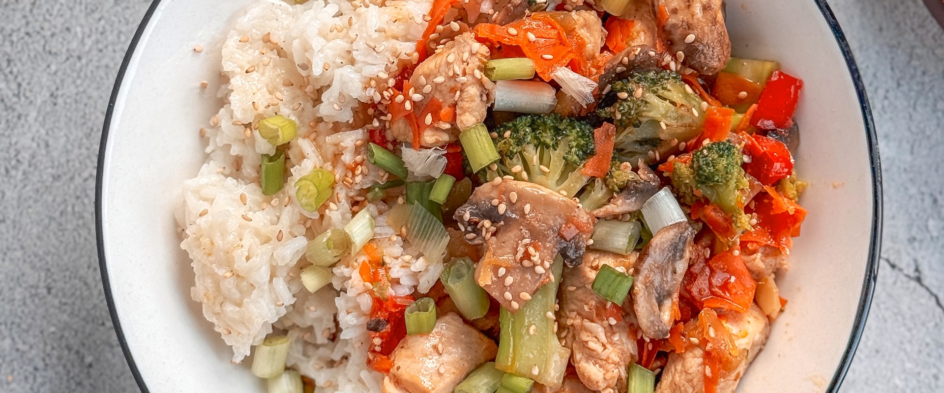 chicken and mixed vegetables stir fry in skillet