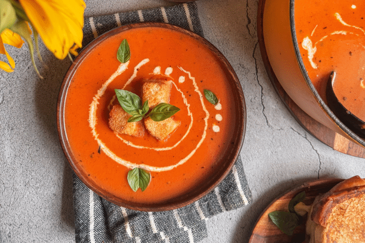 Cozy up with this Creamy Roasted Tomato Soup made from oven-roasted tomatoes, garlic, and herbs. Smooth, rich, and full of flavor — perfect for chilly days!