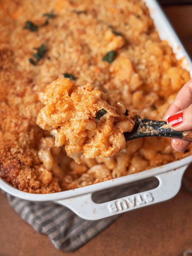 southern baked mac and cheese with golden crispy topping in casserole dish