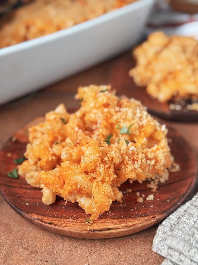 southern baked mac and cheese with golden crispy topping in casserole dish