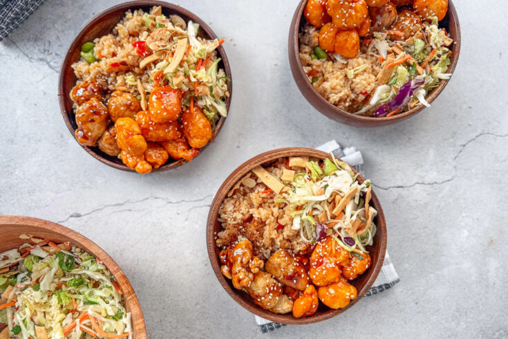This tasty brings together crispy, saucy chicken, savory vegetable fried rice, and a fresh cabbage slaw with a bright sesame-ginger dressing for balance and crunch. The combination of warm, bold entrées and cool, tangy slaw creates a restaurant-style experience at home, without too much work.