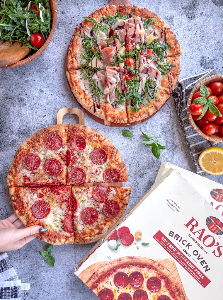 Rao’s Brick Oven-Style 5 Cheese Pizza baked and sliced on a serving board