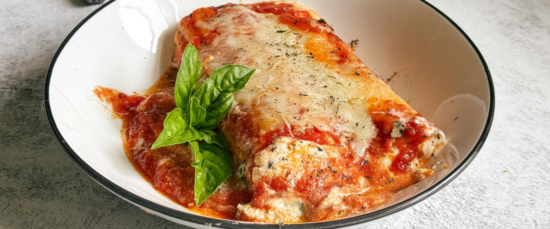 Creamy spinach and ricotta stuffed pasta baked with marinara sauce and melted cheese until bubbly and golden. An easy, cozy family-friendly pasta dinner.