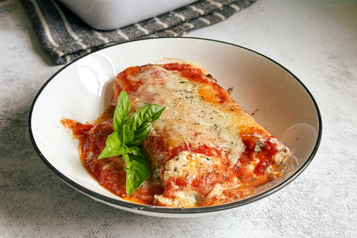Easy baked stuffed pasta tubes filled with ricotta, spinach, mozzarella, and Parmesan cheese in rich marinara sauce. Cozy family-friendly comfort food recipe.