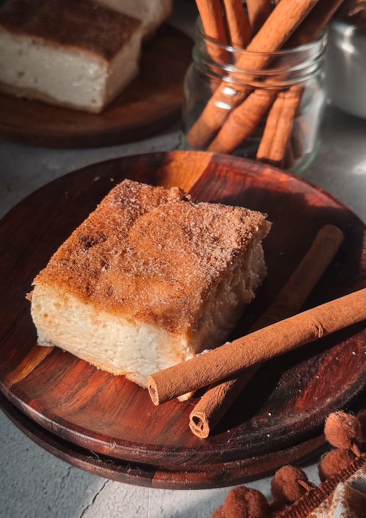Churro cheesecake bars with a thick, creamy filling, buttery crescent dough and cinnamon sugar.