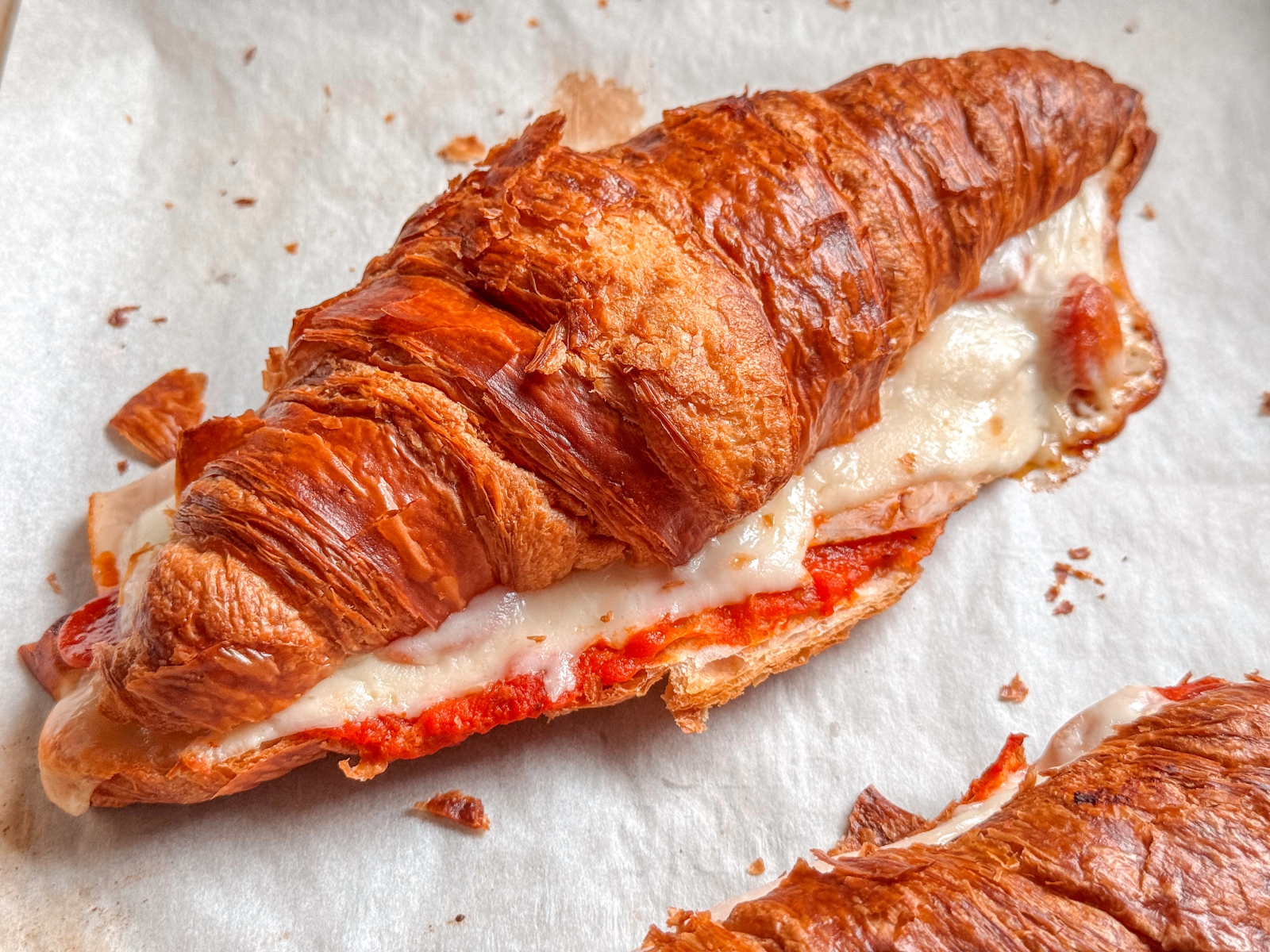 Make easy pizza croissant sandwiches with leftover Costco croissants, marinara, mozzarella, smoked turkey, and pepperoni. Ready in 15 minutes!