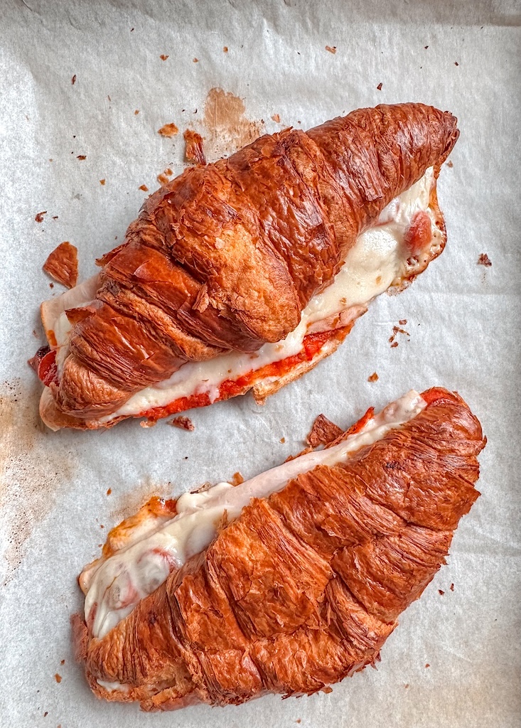 Pizza croissant sandwich made with leftover Costco croissants, mozzarella cheese, smoked turkey, pepperoni, and marinara sauce.